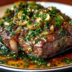 Herb-Crusted Slow-Cooked Lamb with Fresh Mint and Lemon Zest Gremolata